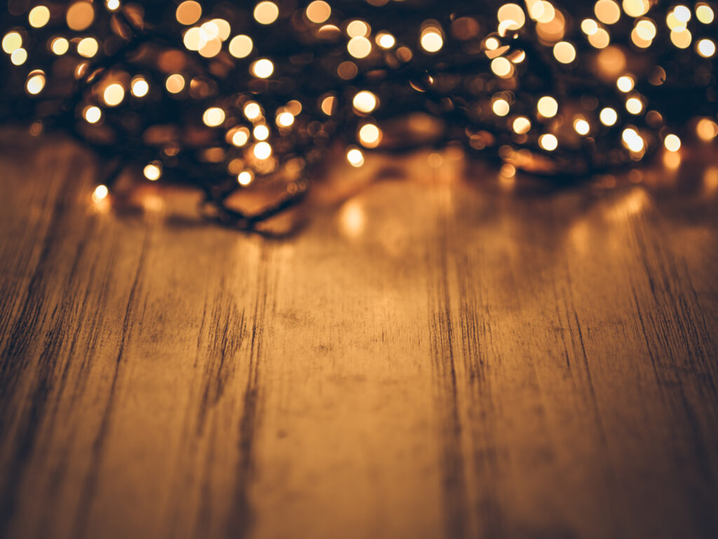 Brighten your holidays with Solar-Powered String Lights: a festive and eco-friendly choice for vibrant Christmas decorations. The image captures the charm of these lights, illuminating a cozy outdoor setting with a warm and inviting glow, creating a magical atmosphere for festive celebrations.